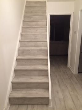 Grey quickstep flooring on staircase